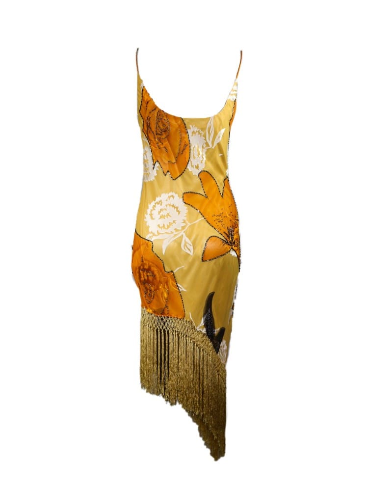Vestido ocre dorado, con pedrería y flecos Vestido ocre dorado, con pedrería y flecos